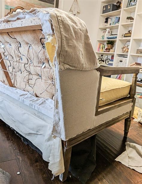 A reupholstered couch can make the living room it graces look much better. How to reupholster a couch on the cheap - Lovely Etc.