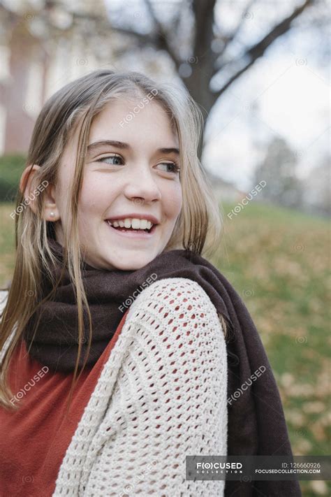 Teenage girl laughing — outdoors, vertical - Stock Photo | #126660926