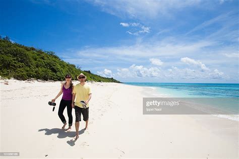 Couple Enjoying Paradise Beach Of Tropical Island Photo Getty Images