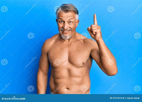 Middle Age Grey Haired Man Standing Shirtless Pointing Finger Up With Successful Idea Stock