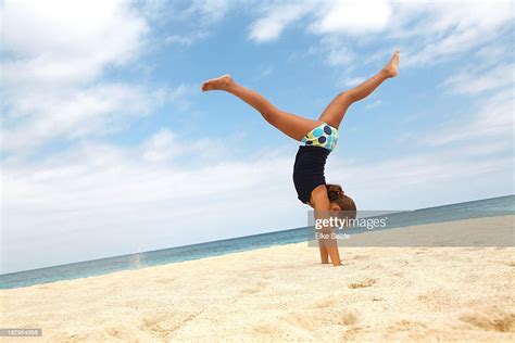 Girl Doing Handstand On Beach High Res Stock Photo Getty Images