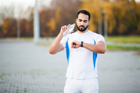 Fitness Young Sports Man Drinking Water After Workout Stock Image