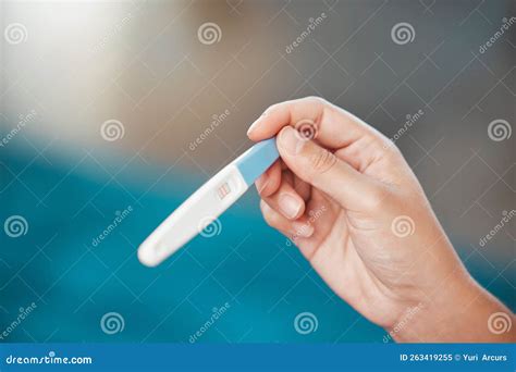 Hands Pregnancy Test And News With Positive Results For Pregnant Lines Or Information At Home