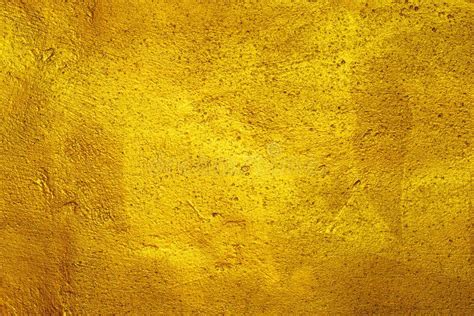 Roughly Plastered Wall Texture Background Painted With Gold Paint Stock