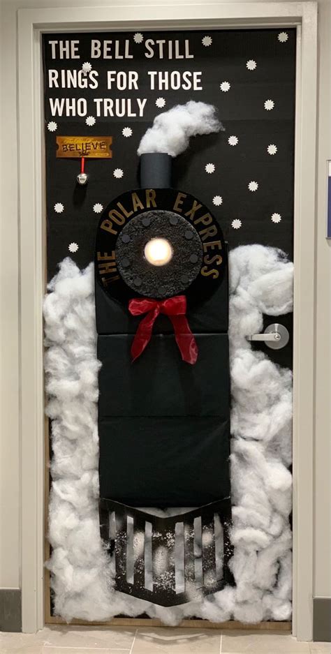 A Door Decorated To Look Like A Train With Clouds And Snow Around It