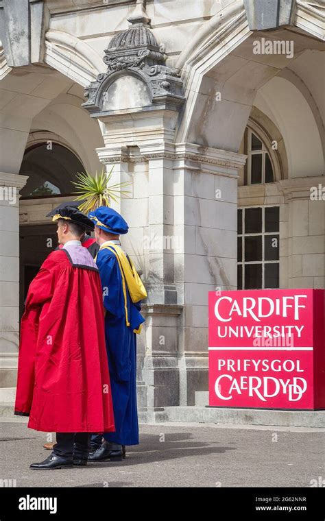 Students With Academic Dresses Celebrating Graduation Day In Cardiff
