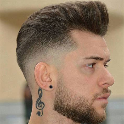 Meanwhile, a mid fade paired with a slick back or natural curls looks polished and sophisticated. Mid Fade Haircut