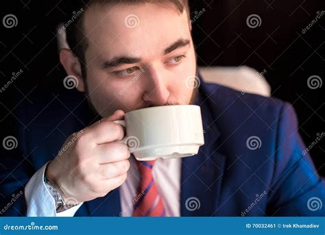 Rich Successful Handsome Man In A Suit Drinking Coffee Stock Image