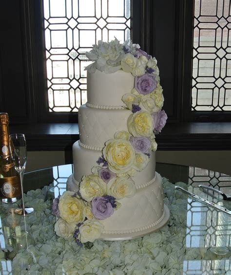 It seems simple enough that i can make it in an hour or two but my biggest question is.are fresh flowers safe on a cake? 4 tier fondant wedding cake with white and purple fresh ...