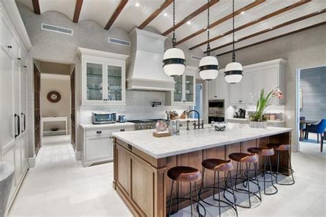 White cabinets create a light and clean look in a kitchen. Gorgeous Gourmet Kitchen With Wood Island | 2019 HGTV's ...