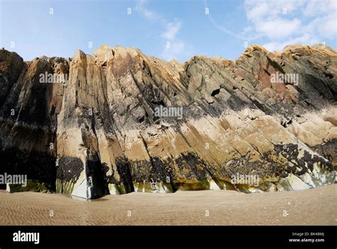 Sea Cliff Showing Rock Strata And Layers Together With Tidemarks Stock