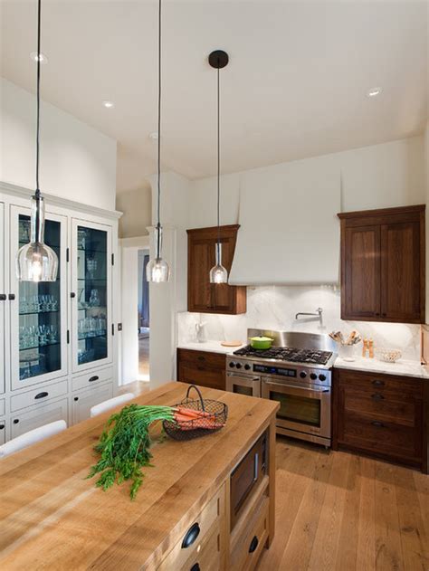 This kitchen is lit with recessed lighting that is arranged in an asymmetrical pattern on the kitchen this large brightly lit kitchen uses 5 pendent lights to highlight the island eating area. Kitchen Pendant Lighting Ideas | Houzz