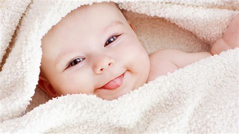 Cute Baby Covered With White Woolen Towel With Tongue Out Smiley HD 
