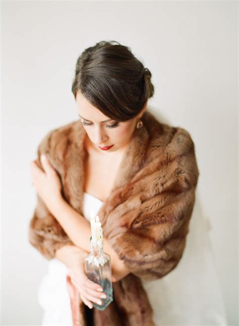 If you want to keep your guests warm and provide them with thoughtful wedding favours, pashminas are a perfect choice. Fur Stole - Elizabeth Anne Designs: The Wedding Blog