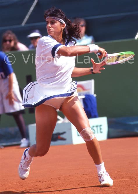 gabriela sabatini of argentina returns a shot during ladies singles play at the 1992 french open