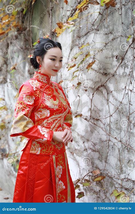 Young Beautiful And Elegant Chinese Woman Wearing A Typical Chinese