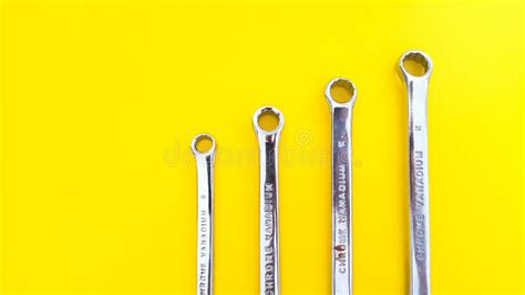 Various Sizes Of Wrench Or Spanner Isolated On Yellow Background Stock