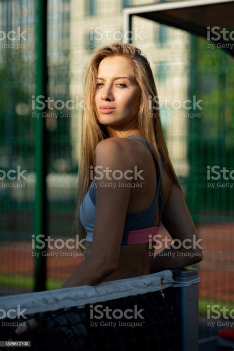 Beautiful Blonde Woman With Perfect Body Wearing Sport Apparel Posing