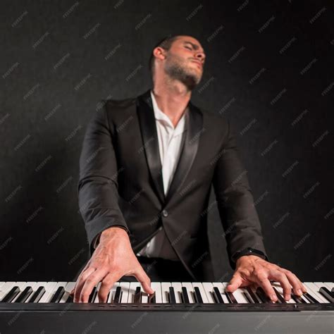 Free Photo Front View Passionate Musician And His Digital Piano