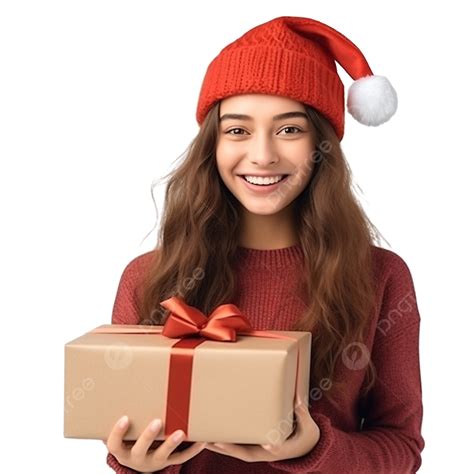 فتاة مبتسمة ترتدي قبعة عيد الميلاد وتحمل بين يديها صندوق هدايا فتاة
