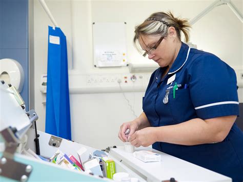 Nurse During A Drug Administration On A Uk Hospital Ward Wellcome