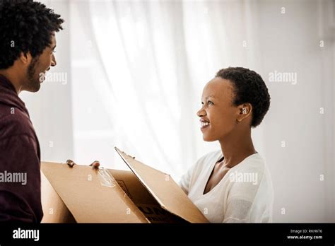 Happy Couple Moving Into Their New Home Stock Photo Alamy