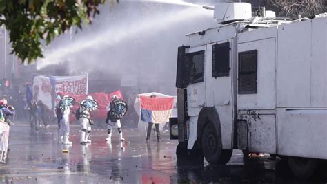 Chile Police Uses Water Cannons Tear Gas To Disperse Rioters At