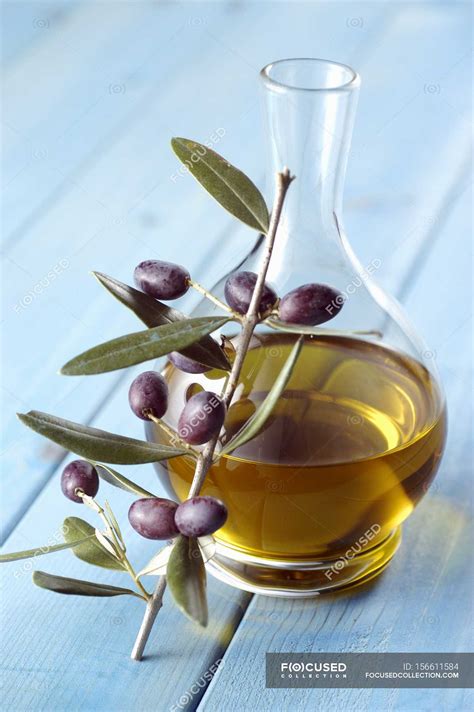 Carafe Of Olive Oil And Sprig Of Olives — Cuisine Appetite Stock