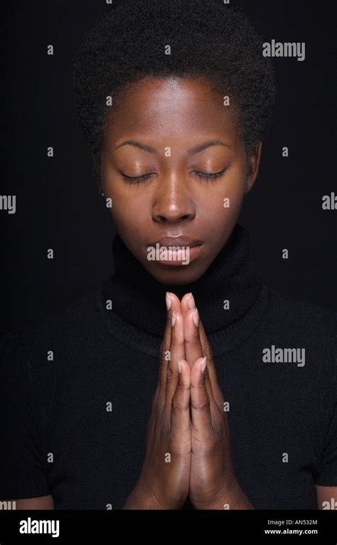 Close Up Of African Woman Praying Stock Photo Alamy