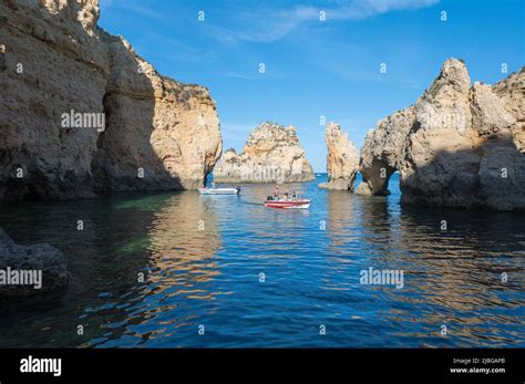 Lagos, Portugal. 2022 May 06 . People on the pier of Miradouro da Ponta