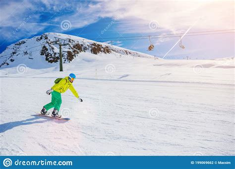 Girl Snowboarder Having Fun In The Winter Ski Resort Stock Photo