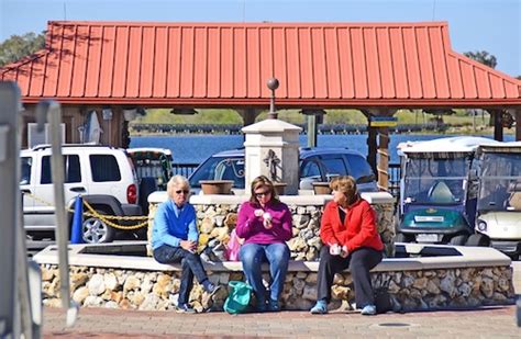 Friends Enjoying Ice Cream At Lake Sumter Landing In The Villages