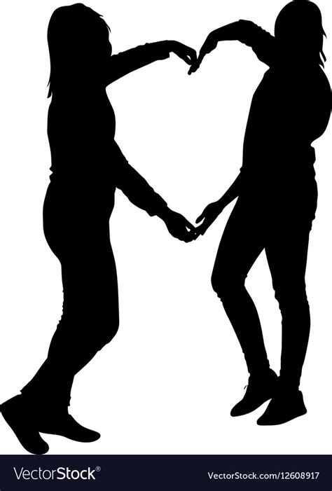 silhouette two girls holding hands in heart shape vector image
