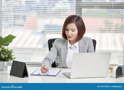 Young Attractive And Confident Business Woman Working In Office Stock