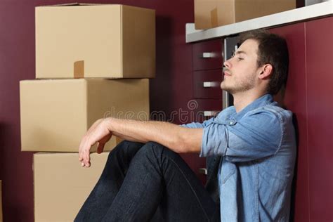Sad Man Moving Home Sitting In The Kintchen Floor Stock Photo Image