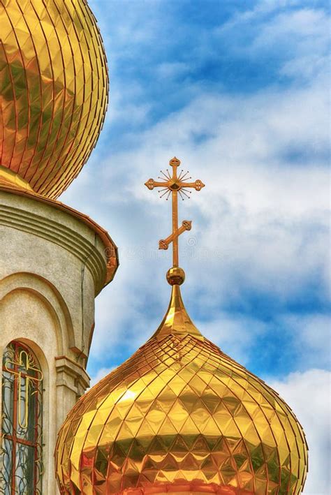 Orthodox Church Golden Domes With Crosses Close Up Against A Blue