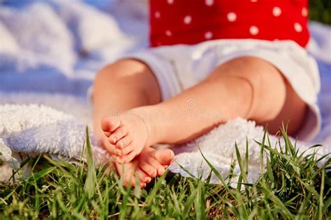 Close Up Of The Little Baby Legs On A Green Grass Stock Image Image