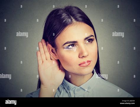 Woman With Hand To Ear Gesture Listening Carefully Stock Photo Alamy