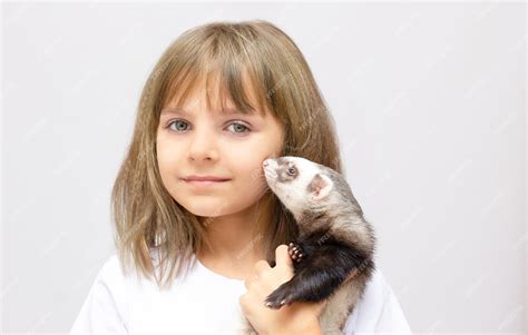 Premium Photo Cute Little Girl Holding A Ferret Pet Isolated On