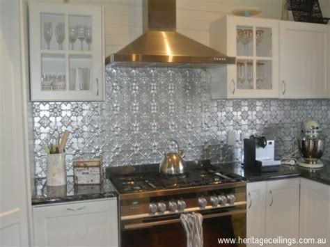 When you cover your ceiling with richly patterned, stamped metal, suddenly everyone is looking up! Pressed Tin Backsplash Kitchen | tin ceilings in kitchens ...