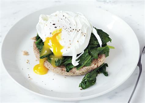 Slowly slide eggs into water while immersing cup slightly in water. Sunday Brunch Eggs Florentine | My Gym Nutrition Blog