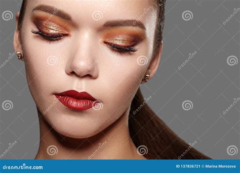 Beautiful Woman With Professional Makeup Party Gold Eye Make Up