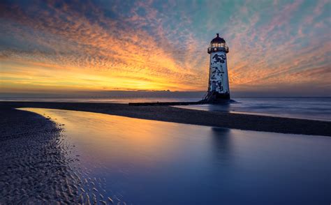 Sunset Lighthouse By Adrian Evans Photo 72147385 500px