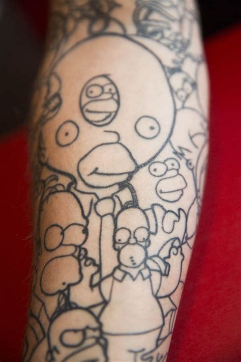 Got treehouse of horror homer on my leg! The Simpsons superfan shows off 52 Homer tattoos | Daily Star