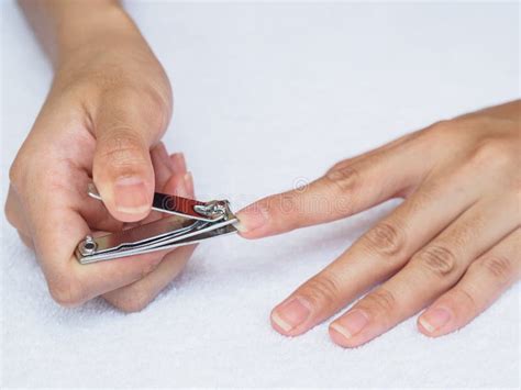 Woman Cutting Nails Using Nail Clipper On White Background Heal Stock