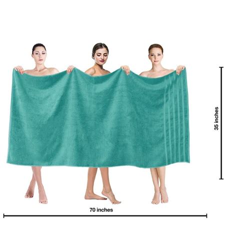 Three Women Are Holding Up A Towel To Show Their Size