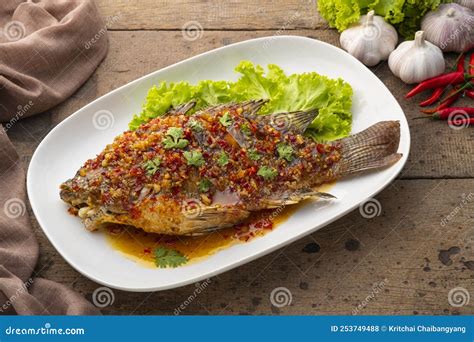 Deep Fried Tilapia Fish With Hot Sweet And Sour Sauce Stock Photo