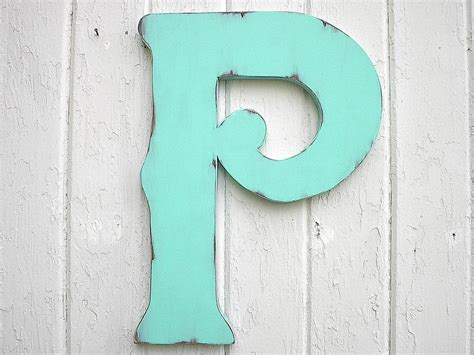 Want to create a unique wall display with minimal effort? Wooden Letters Decorative P 18 Wall Decor Distressed