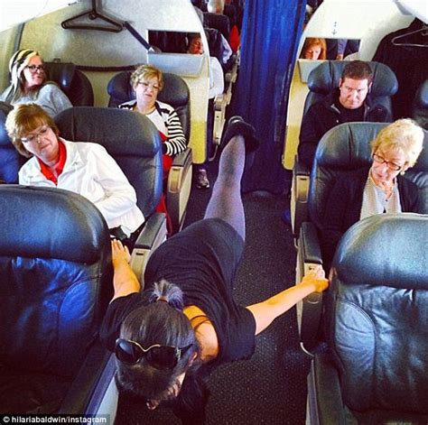 Female Passenger On Flight From La To San Lucas Does Yoga Upside Down