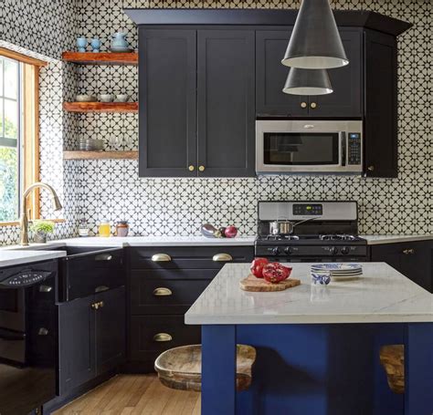 Tall black cabinets with light quartz countertops, walls, and floor in gray shades in this gorgeous kitchen, honed absolute black granite countertops balance white shaker cabinets while white subway tile gives sparkle and glow to. Kitchens With Black Cabinets